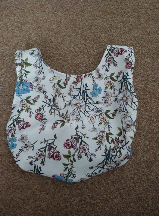 A peg bag made from the top half of a dress