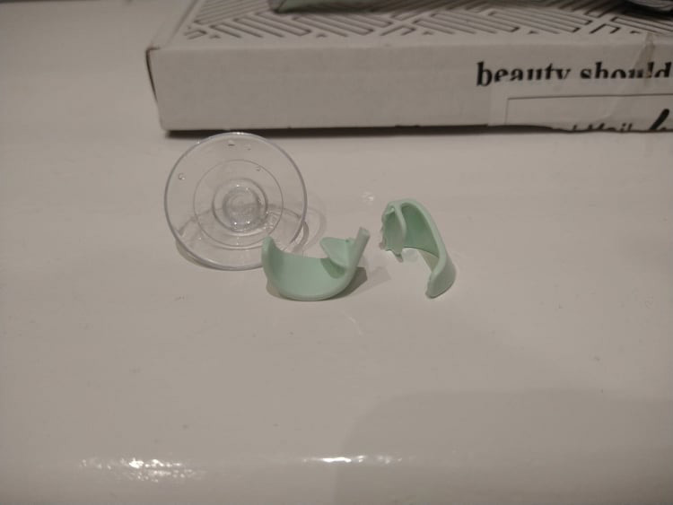 The FFS razor holder, broken in half.