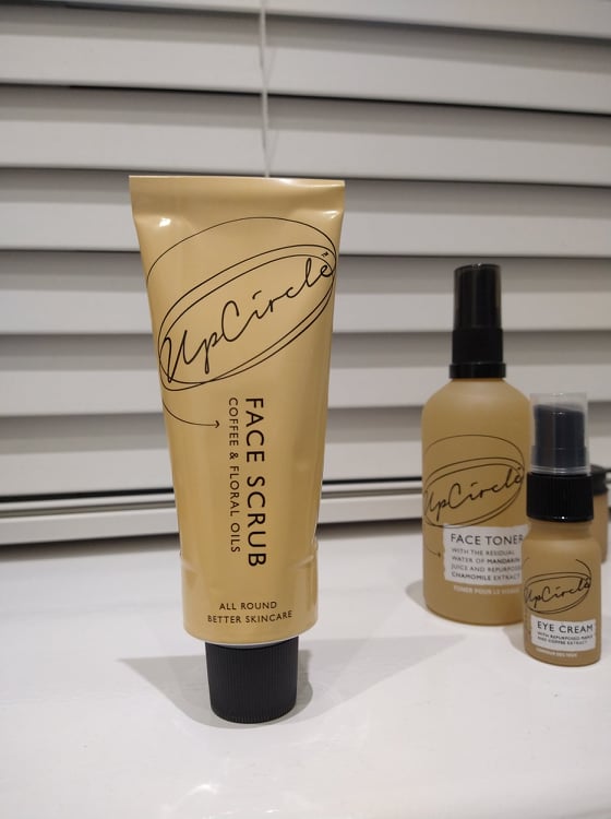 Upcircle's Face Scrub aluminium tube in a peach colour.