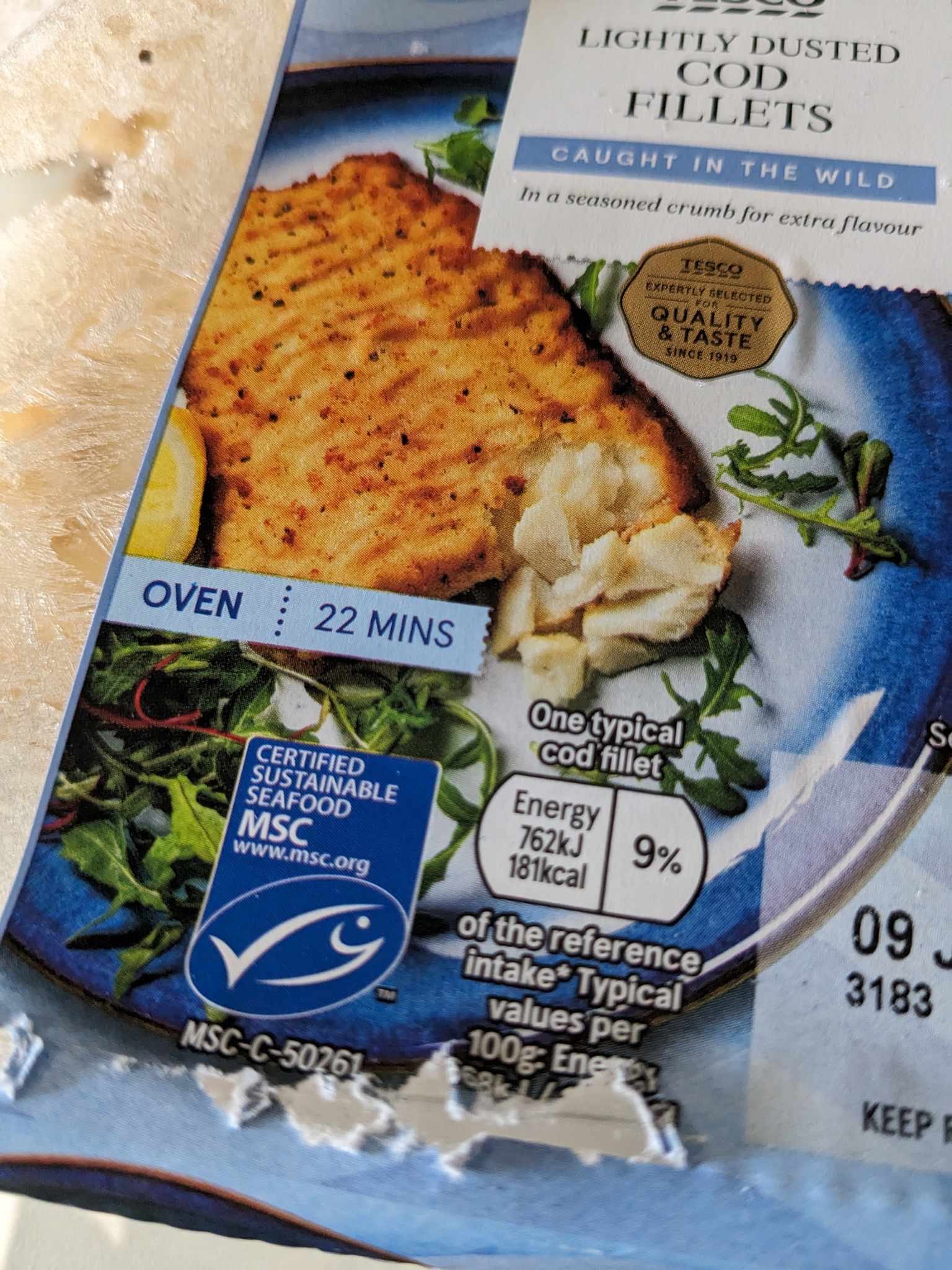 A close-up of the MSC-approved blue tick label on a pack of Tesco breaded cod fillets.