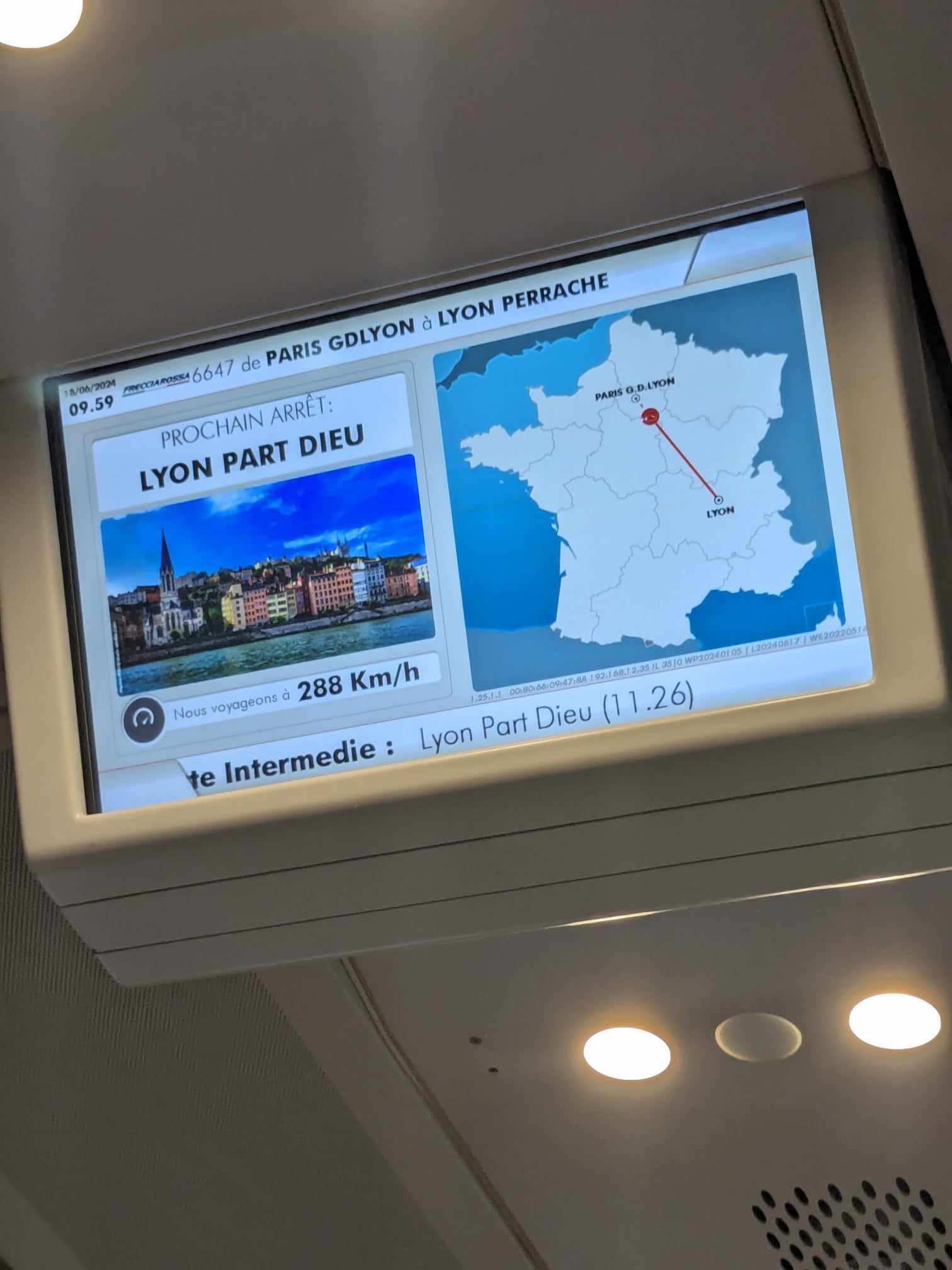 A screen on a Freccia Rosa train to Lyon, showing the distance being travelled on a map.